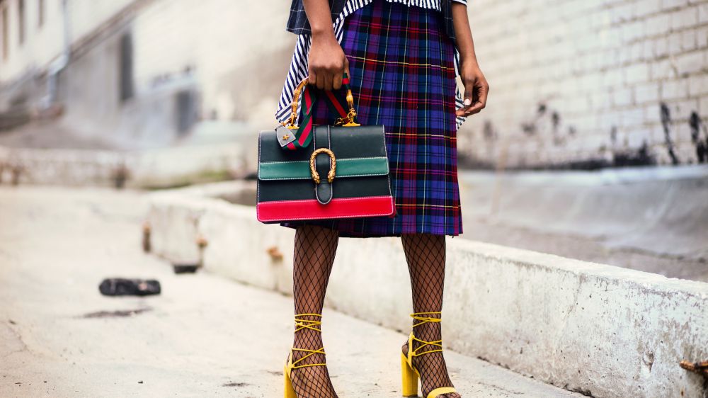 Woman Holding Green And Red Leather Handbag 932401